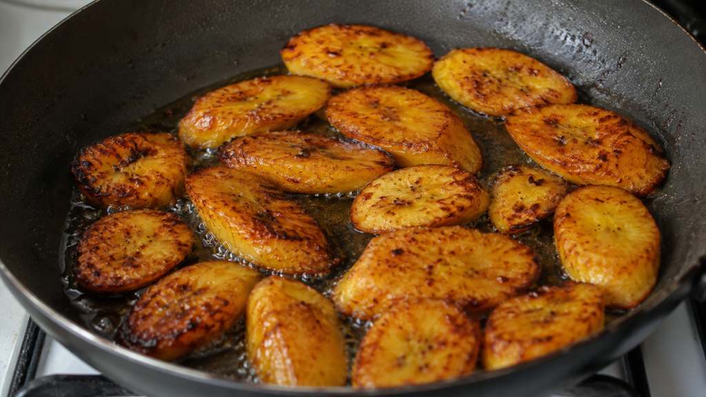 Fried plantains served with grilled chicken and rice