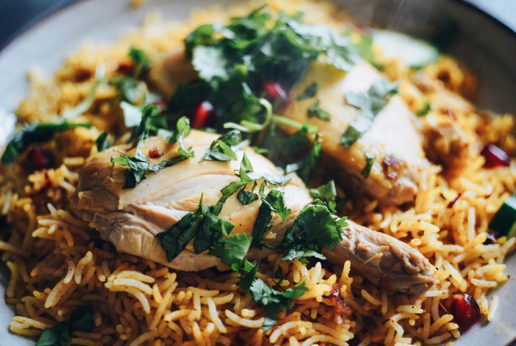 Homemade chicken biryani with basmati rice and fresh mint