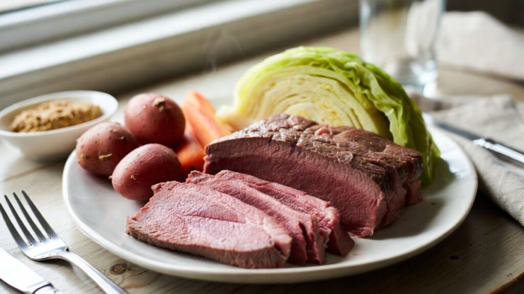 Family-style corned beef dinner served on the table