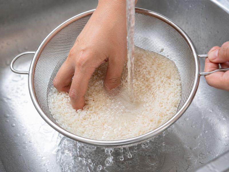 rinsing rice before making yellow rice