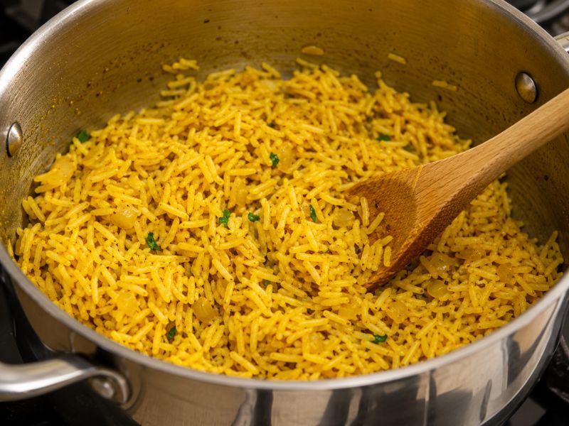 toasting rice with turmeric and spices