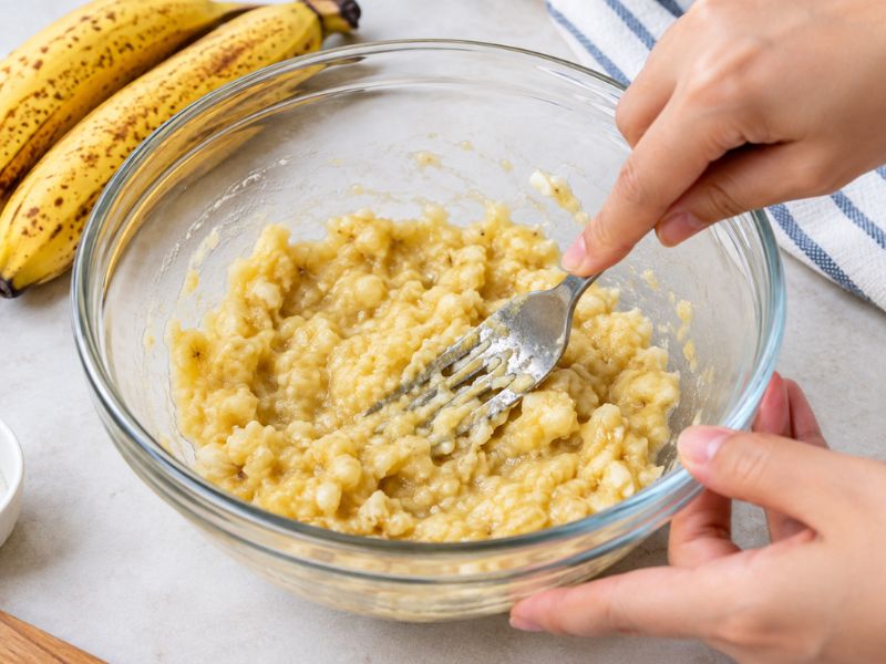 Mashed ripe bananas for healthy breakfast cookies
