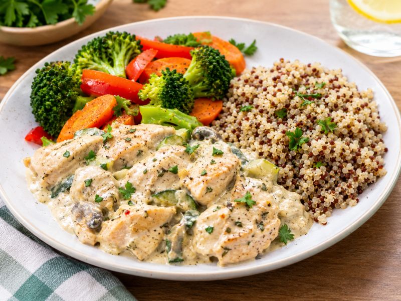 Healthy creamy chicken meal with vegetables and whole grains