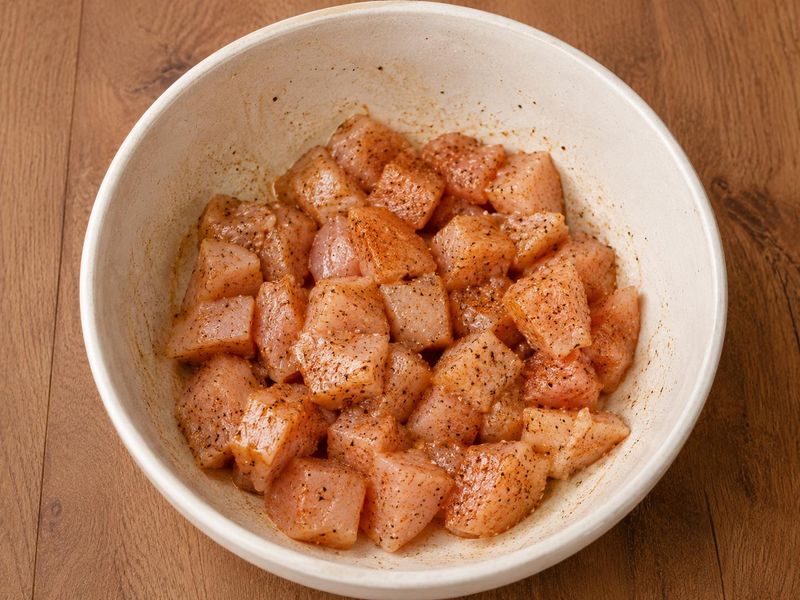 Chicken pieces coated with paprika, Italian seasoning, thyme, salt, and black pepper