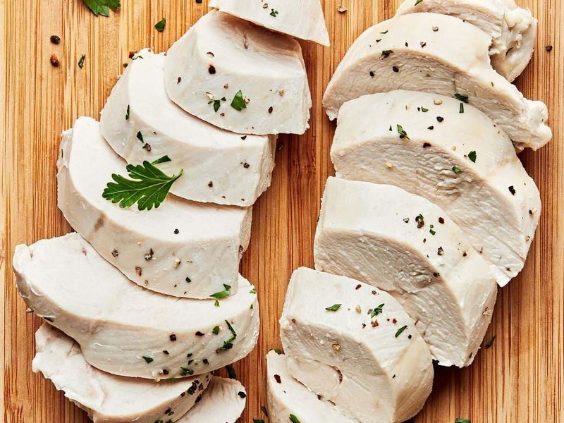 Tender boiled chicken breast sliced into even pieces for salads, sandwiches, and rice bowls.
