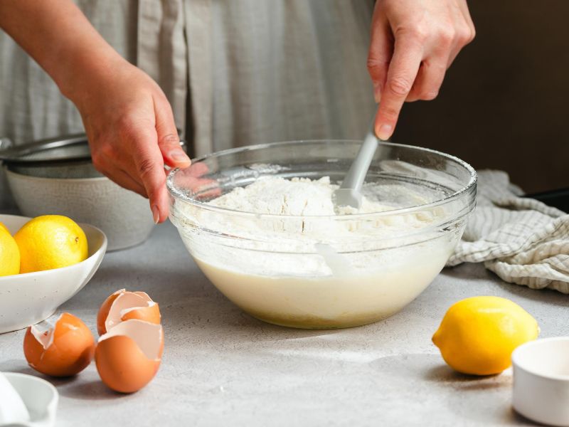 Smooth lemon yogurt cake batter mixed with yogurt, eggs, flour and lemon juice