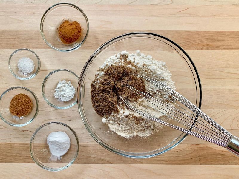 Flour, baking soda, cinnamon, nutmeg, and salt whisked together for applesauce cake